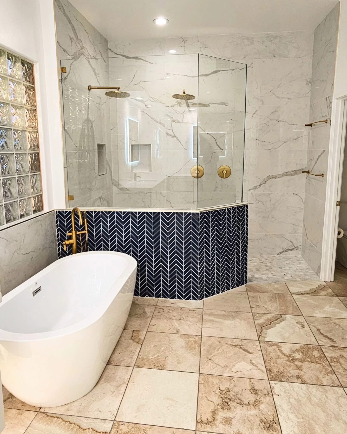 Completed bathroom remodel with plumbing fixtures and finish hardware